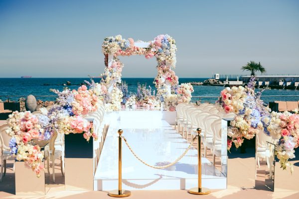 wonderful-wedding-ceremony-place-near-sea-decorated-by-flowers-min